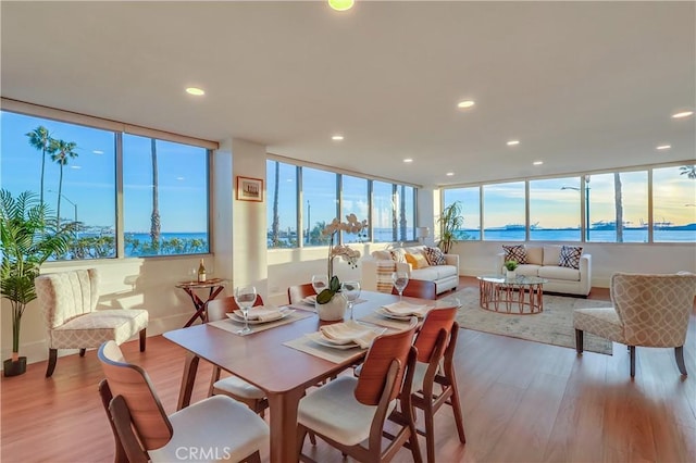 2999 E Ocean Blvd Unit 210, Long Beach, CA 90803 - dining space with wood finished floors, recessed lighting, and baseboards