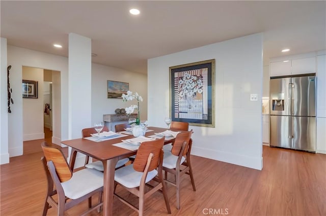 2999 E Ocean Blvd Unit 210, Long Beach, CA 90803 - dining area featuring baseboards, light wood-style floors, and recessed lighting