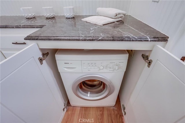 2999 E Ocean Blvd Unit 210, Long Beach, CA 90803 - laundry room featuring washer / clothes dryer and wood finished floors
