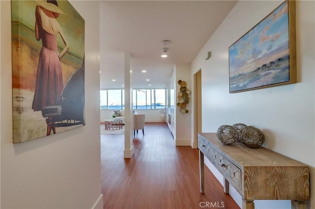 2999 E Ocean Blvd Unit 210, Long Beach, CA 90803 - hallway featuring wood finished floors, recessed lighting, and baseboards