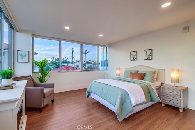 2999 E Ocean Blvd Unit 210, Long Beach, CA 90803 - bedroom featuring light wood-style floors, baseboards, and recessed lighting