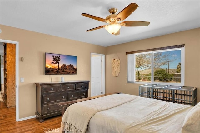 57716 Juarez Dr, Yucca Valley, CA 92284 - bedroom featuring wood finished floors, baseboards, and ceiling fan
