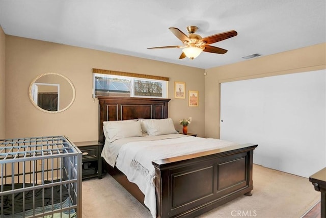 57716 Juarez Dr, Yucca Valley, CA 92284 - bedroom with light carpet and a ceiling fan