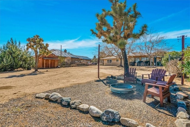 57716 Juarez Dr, Yucca Valley, CA 92284 - view of yard with an outdoor fire pit