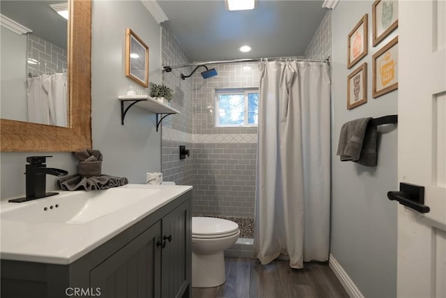 41496 Comstock Ln, Big Bear Lake, CA 92315 - bathroom featuring toilet, a stall shower, wood finished floors, baseboards, and vanity