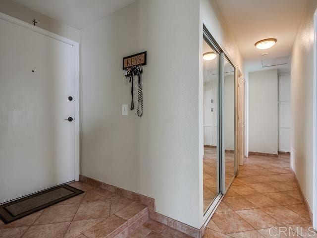 hallway featuring baseboards