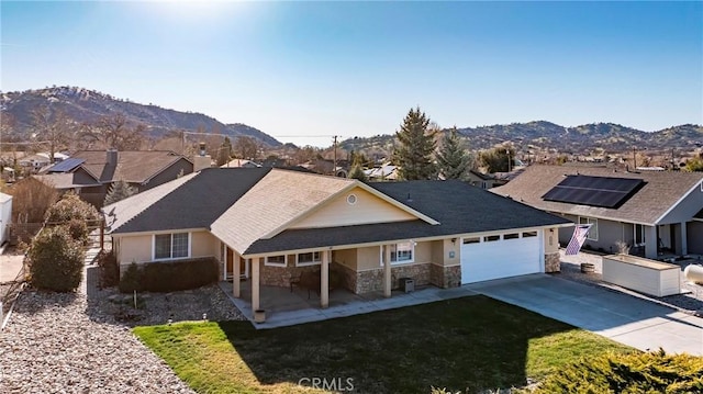18051 Bold Venture Dr, Tehachapi, CA 93561 - ranch-style house featuring driveway, a front lawn, stone siding, a mountain view, and a garage