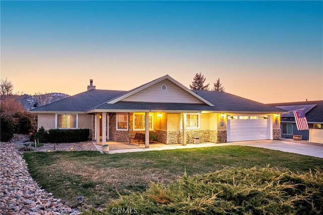 18051 Bold Venture Dr, Tehachapi, CA 93561 - ranch-style house featuring a lawn, a chimney, driveway, stone siding, and an attached garage