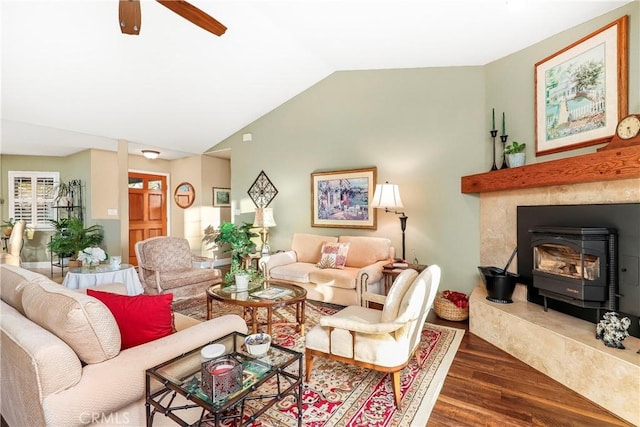 18051 Bold Venture Dr, Tehachapi, CA 93561 - living room featuring lofted ceiling, a wood stove, wood finished floors, and ceiling fan