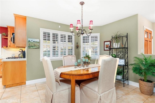 18051 Bold Venture Dr, Tehachapi, CA 93561 - dining room with a chandelier, light tile patterned floors, and baseboards