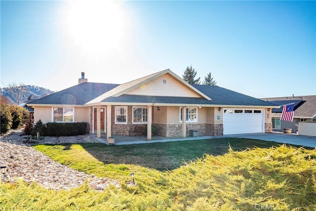 18051 Bold Venture Dr, Tehachapi, CA 93561 - single story home featuring stucco siding, a front lawn, stone siding, a garage, and a chimney