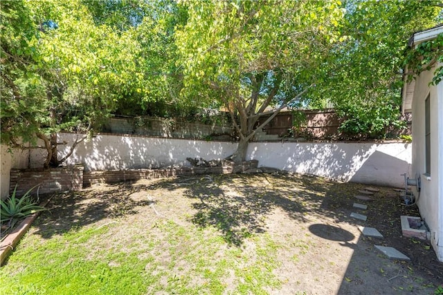 view of yard with a fenced backyard