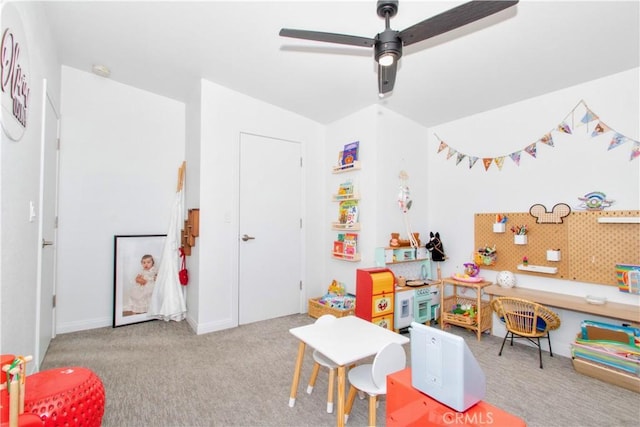 game room with ceiling fan and carpet