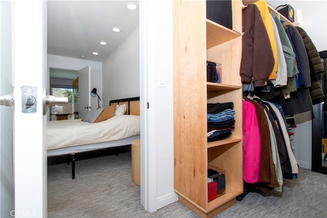 walk in closet featuring carpet