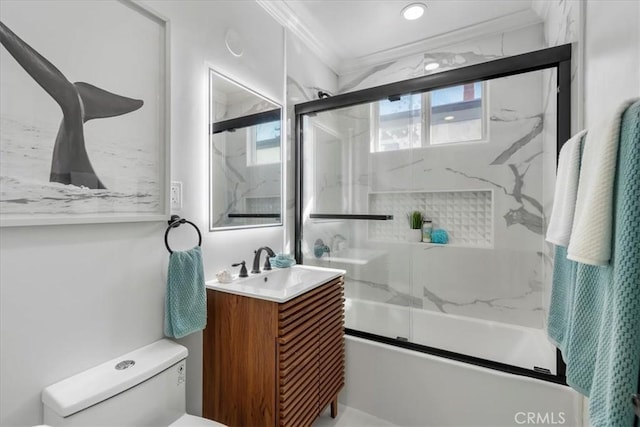 bathroom with vanity, toilet, enclosed tub / shower combo, and ornamental molding