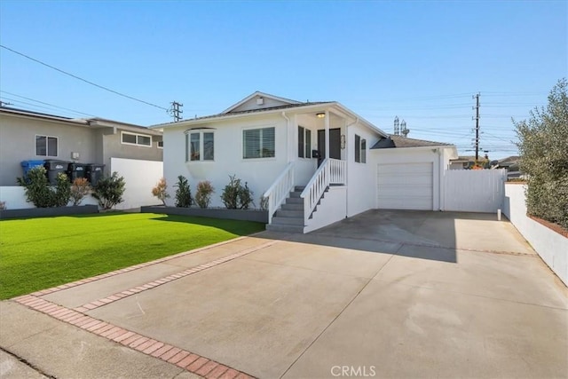 view of front of house featuring fence, concrete driveway, an attached garage, stucco siding, and a front yard