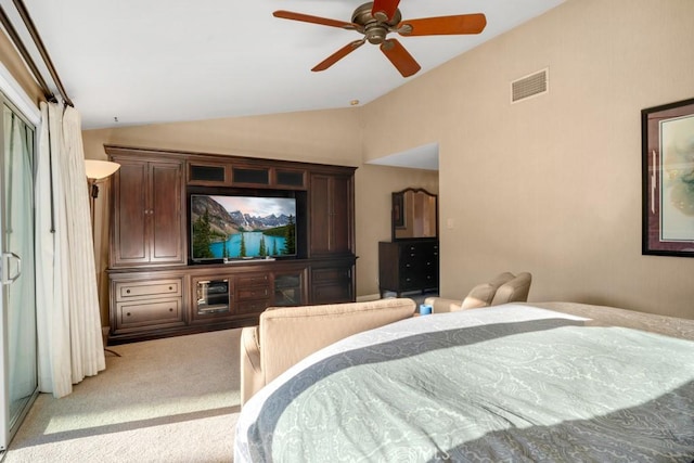 bedroom featuring carpet, visible vents, vaulted ceiling, and a ceiling fan