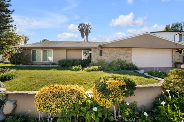 ranch-style home with an attached garage, driveway, stucco siding, and a front yard