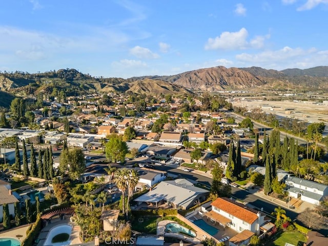 birds eye view of property with a residential view and a mountain view