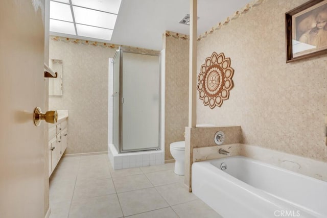 bathroom featuring toilet, a stall shower, wallpapered walls, and tile patterned flooring