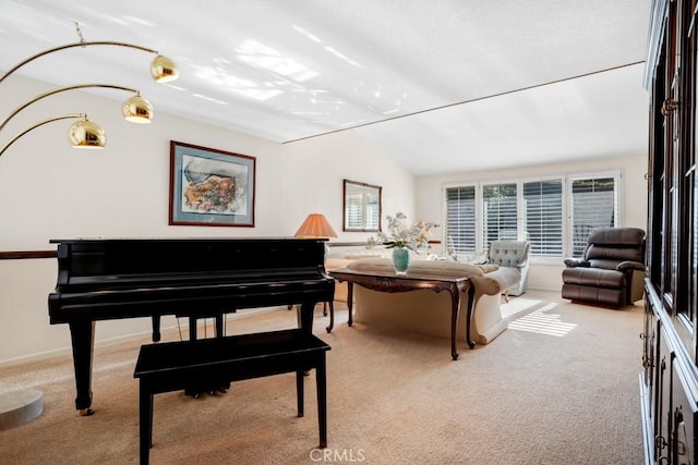 sitting room featuring carpet and vaulted ceiling