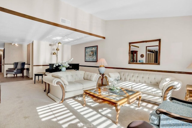 living area with carpet flooring and visible vents