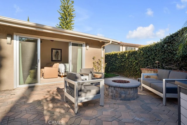 view of patio / terrace featuring a fire pit