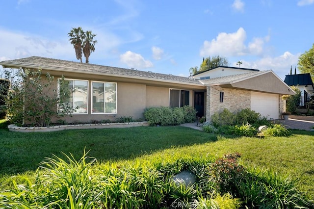 single story home with a garage, stucco siding, stone siding, and a front lawn