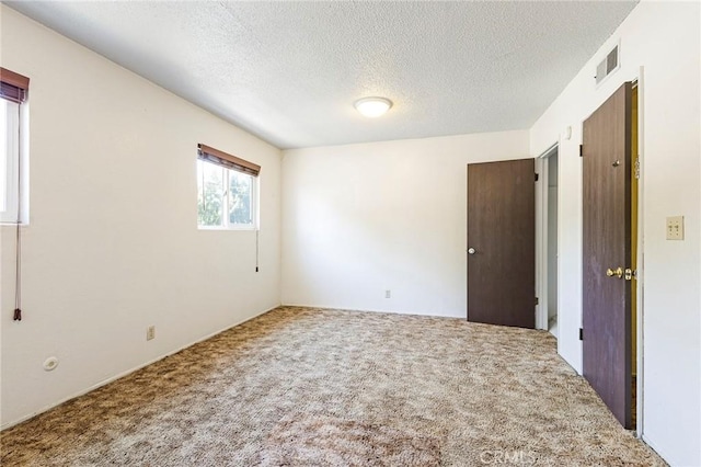 609 Rancheria Dr, Chico, CA 95926 - carpeted empty room featuring a textured ceiling
