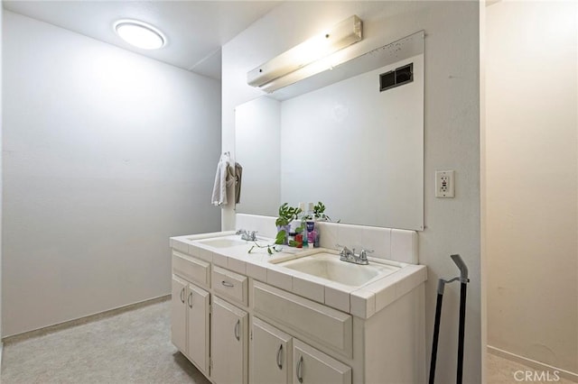 609 Rancheria Dr, Chico, CA 95926 - bathroom featuring double vanity and baseboards