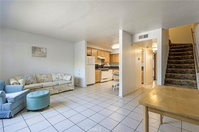 609 Rancheria Dr, Chico, CA 95926 - living area with stairs and light tile patterned floors