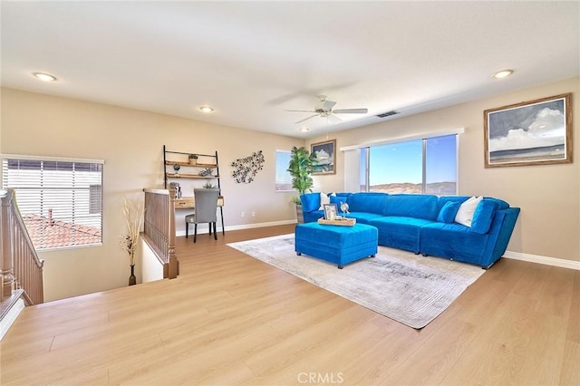 4224 Castlepeak Dr, Corona, CA 92883 - living room featuring a healthy amount of sunlight, visible vents, wood finished floors, and a ceiling fan