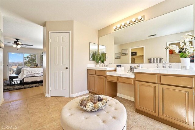 4224 Castlepeak Dr, Corona, CA 92883 - full bathroom featuring connected bathroom, tile patterned floors, a ceiling fan, visible vents, and double vanity