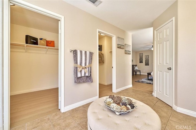 4224 Castlepeak Dr, Corona, CA 92883 - hallway with baseboards, visible vents, and tile patterned flooring
