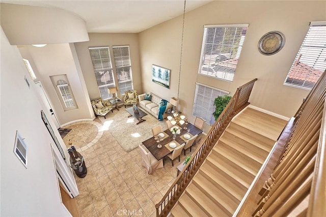 4224 Castlepeak Dr, Corona, CA 92883 - living room featuring baseboards, wood finished floors, and vaulted ceiling