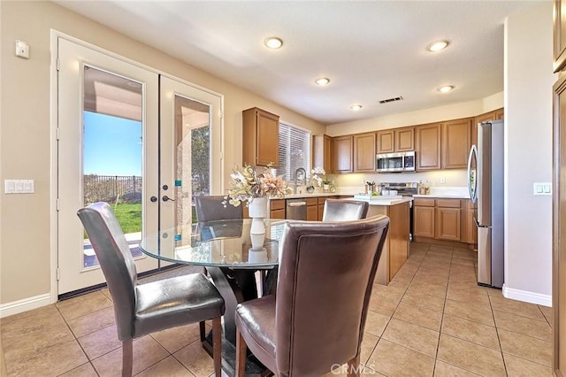 4224 Castlepeak Dr, Corona, CA 92883 - dining room featuring light tile patterned flooring, visible vents, a healthy amount of sunlight, and recessed lighting