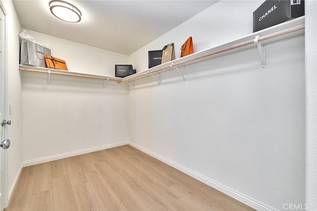 4224 Castlepeak Dr, Corona, CA 92883 - spacious closet featuring light wood-type flooring