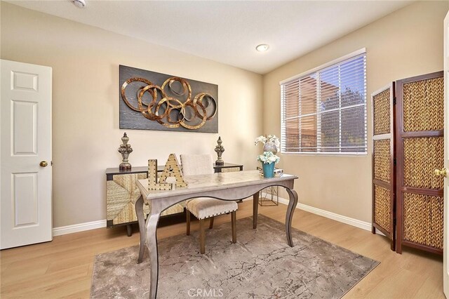 4224 Castlepeak Dr, Corona, CA 92883 - home office featuring baseboards and wood finished floors