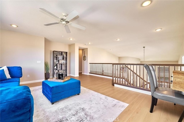 4224 Castlepeak Dr, Corona, CA 92883 - living room featuring vaulted ceiling, a ceiling fan, wood finished floors, baseboards, and recessed lighting