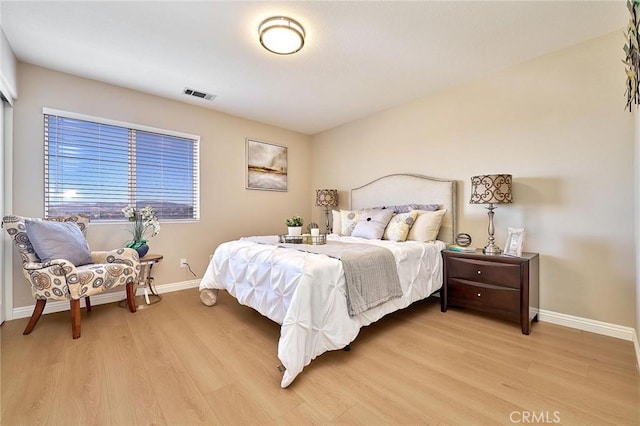 4224 Castlepeak Dr, Corona, CA 92883 - bedroom with baseboards, light wood-style floors, and visible vents