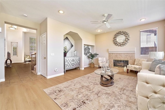 4224 Castlepeak Dr, Corona, CA 92883 - living room featuring plenty of natural light, baseboards, light wood-type flooring, and ceiling fan