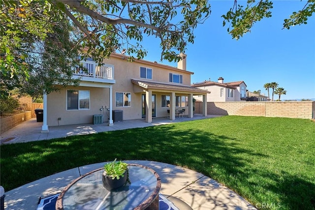 4224 Castlepeak Dr, Corona, CA 92883 - rear view of property with stucco siding, fence, and a patio