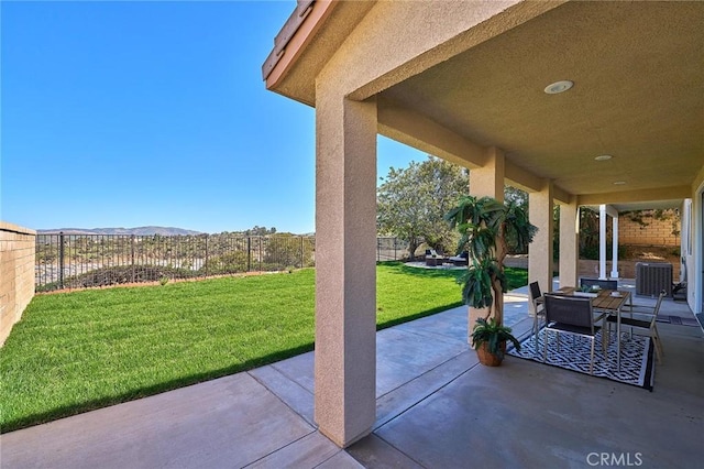 4224 Castlepeak Dr, Corona, CA 92883 - view of patio featuring a mountain view, central AC, and fence