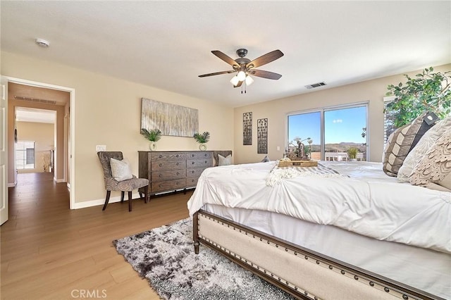 4224 Castlepeak Dr, Corona, CA 92883 - bedroom featuring baseboards, access to exterior, visible vents, a ceiling fan, and wood finished floors
