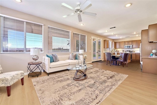4224 Castlepeak Dr, Corona, CA 92883 - living area with a ceiling fan, baseboards, and light wood-style floors