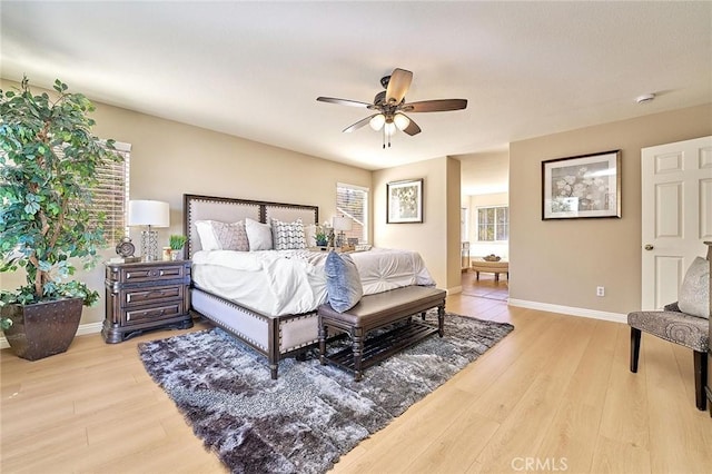 4224 Castlepeak Dr, Corona, CA 92883 - bedroom with baseboards, multiple windows, and light wood-type flooring