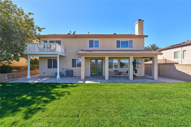 4224 Castlepeak Dr, Corona, CA 92883 - rear view of property featuring a patio, cooling unit, french doors, and a yard