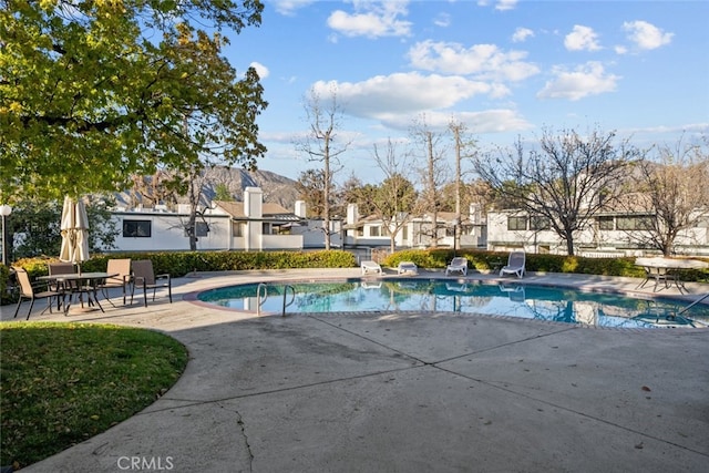 outdoor pool featuring a patio