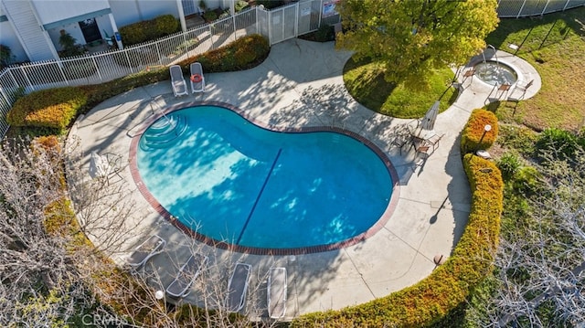view of pool with fence and a patio