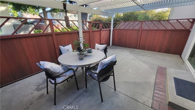 view of patio / terrace featuring a pergola, outdoor dining space, and a fenced backyard